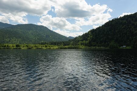 a trip along Teletskoye Lake on a motorboat in the Altai Mountainsの写真素材