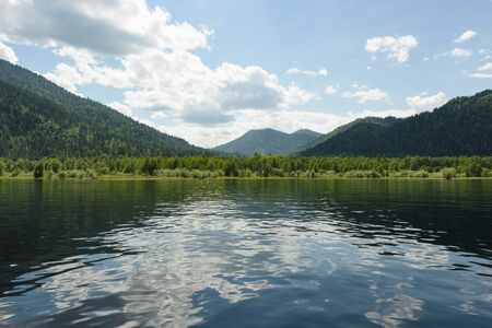 a trip along Teletskoye Lake on a motorboat in the Altai Mountainsの写真素材