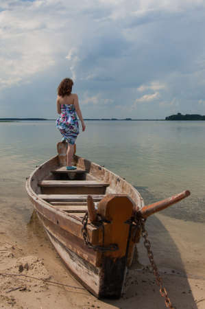 A lovely girl enjoys beauty of terrific Svityaz Lakeの写真素材