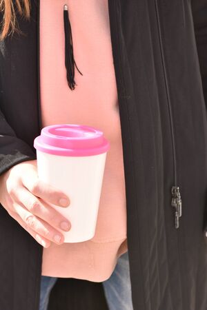 Woman hand holds eco coffee cup.Sustainable lifestyle concept.の写真素材
