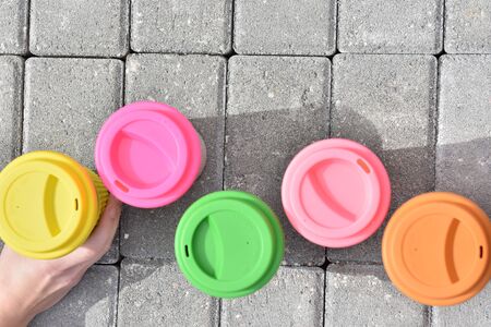 bamboo reusable coffee or tea cups mugs with multicolor silicone cap.の写真素材