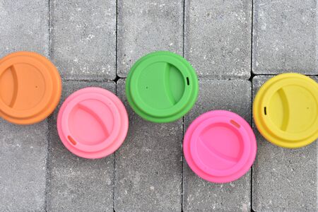 bamboo reusable coffee or tea cups mugs with multicolor silicone cap.の写真素材