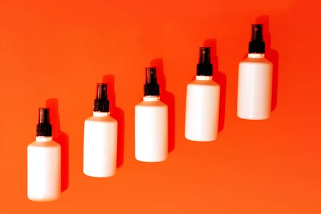 Antibacterial spray for hands sanitizer on orange background.の写真素材