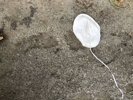 White protective face mask beside the road.の写真素材