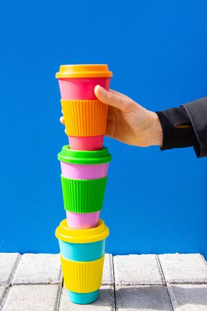 One womans hand taking eco coffee cup. Zero waste concept.の写真素材