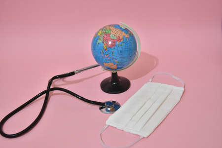 Earth globe with stethoscope and face mask.のeditorial素材