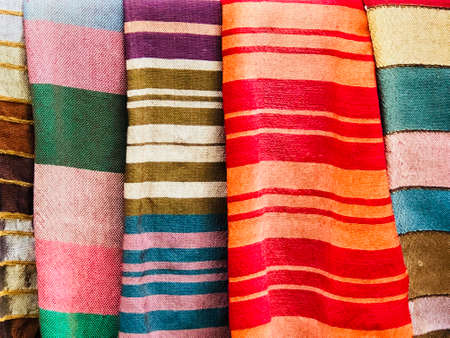 Morocco,Medina of Essaouira. 15 August 2018: Handmade cotton and Silk scarf.Multi different colors and patterns on the market,in a factory shop or store or bazar. card from Moroccoのeditorial素材