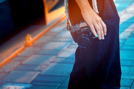 Woman photographer working outdoors,handmade Macrame camera strapの写真素材