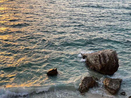 Rocky beach and crystal turquoise water of Ionian Sea in Albania.の写真素材