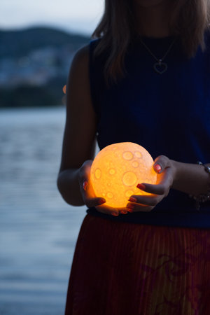 Close up moon in womans hands. Astrology conceptの写真素材