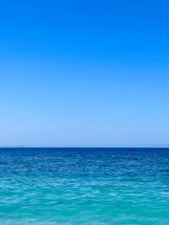Rocky beach and crystal turquoise water of Ionian Sea in Albania.の写真素材