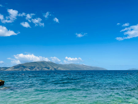Rocky beach and crystal turquoise water of Ionian Sea in Albania.の写真素材
