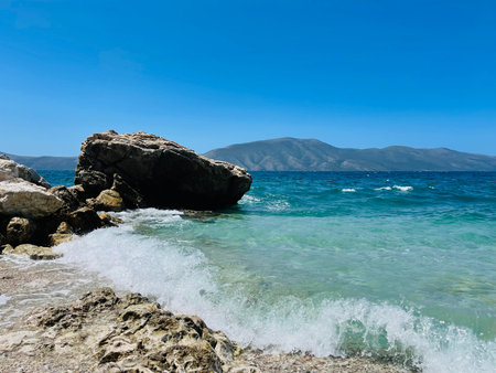 Rocky beach and crystal turquoise water of Ionian Sea in Albania.