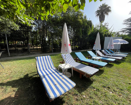 Sun bed beside swimming pool. holidays in Albania.のeditorial素材