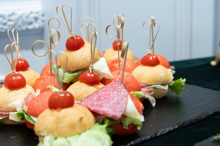 Mini Small burgers served on one plate as appetizers .の写真素材