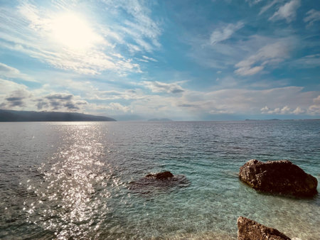 Rocky beach and crystal turquoise water of Ionian Sea in Albania.の写真素材