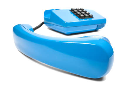 Blue landline phone on isolated white backgroundの写真素材