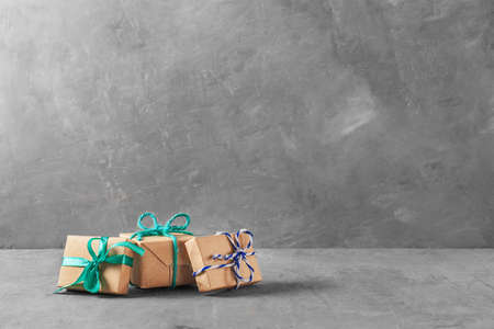 gift boxes on a background of gray wallの写真素材