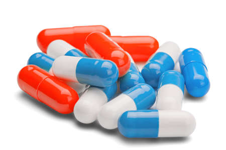 medicine red and blue pills on a isolated white backgroundの写真素材