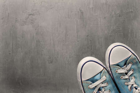 Two blue sneaker on  clean concrete backgroundの写真素材