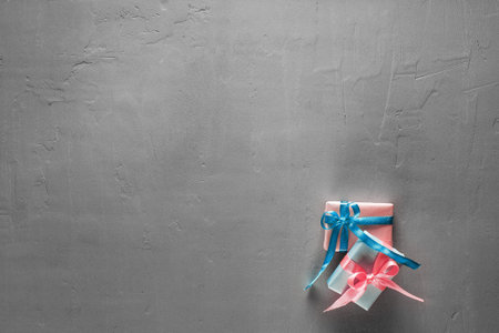 Gift boxes in craft paper on concrete backgroundの写真素材