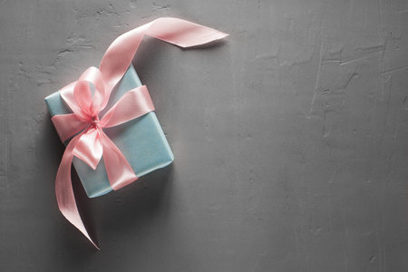 Gift boxes in craft paper on concrete backgroundの写真素材