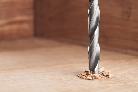 metal drill bit make holes in wooden oaks plank