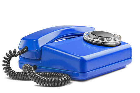 Landline red phone on isolated background with a shadowの写真素材