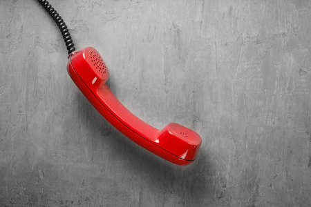 handset from landline phone on the background wallの写真素材