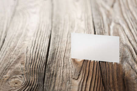 White Blank business card on wooden background. Place for IDの写真素材