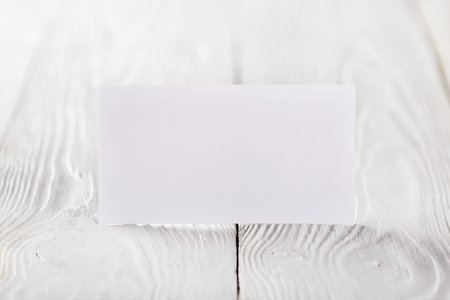 blank business cards on wooden background. Place for ID.