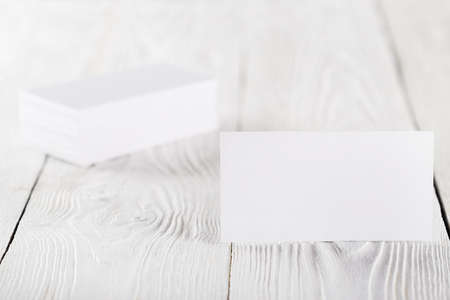 blank business cards on wooden background. Place for ID.の写真素材