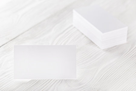 blank business cards on wooden background. Place for ID.