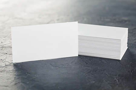White Blank business card on concrete background. Place for IDの写真素材