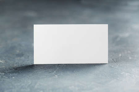 White Blank business card on concrete background. Place for IDの写真素材
