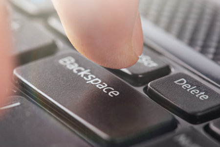 hand presses the keys of a computer keyboard. Work at the computer in the office.の写真素材
