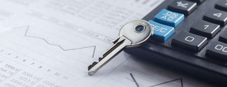 Real estate, keychain with house symbol. Key with finance blank.の写真素材