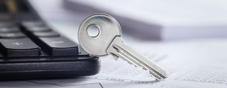 Real estate, keychain with house symbol. Key with finance blank.