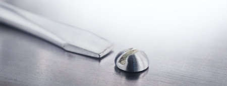 Screwdriver screw in metal steel plate bolt.の写真素材