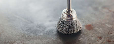 steel brush for drill clean off old metal sheet with rustの写真素材