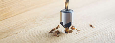 Countersink drill bit make sink in hole for screw in wooden oak plankの写真素材