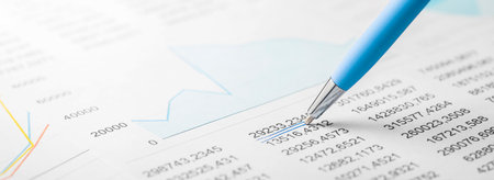 Accounting document with pen, color diagram and checking financial chart. Concept of banking, financial report and financial audit. In blue color.の写真素材