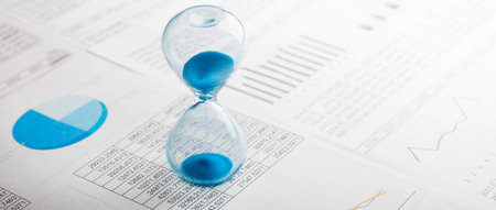 Best time for investment. Hourglass, financial charts and calculator.