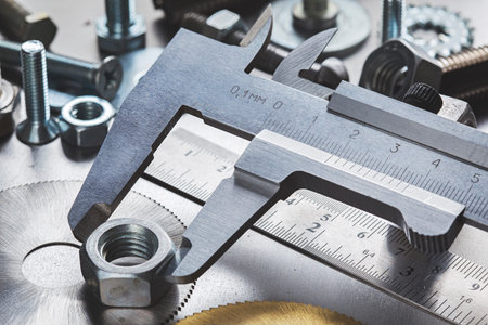 set of different nuts, bolts, screws, washers and drill bits, thread tap and mill cutters on steel...