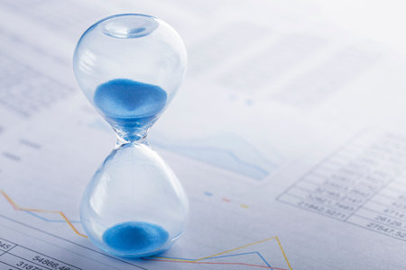 Best time for investment. Hourglass, financial charts and calculator.