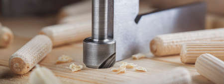 Countersink drill bit make sink in hole for screw in old wooden plankの写真素材