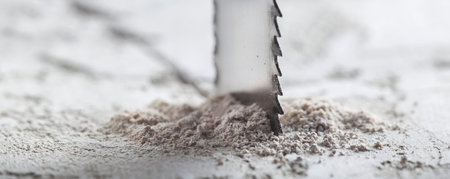Metal saw, end mill or drill bit with diamond coating makes hole in concrete slab. Industry and...