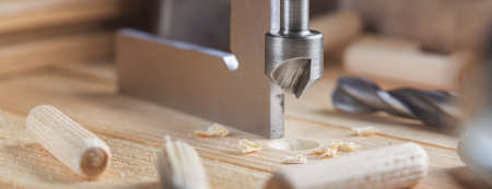 Countersink drill bit make sink in hole for screw in old wooden plankの写真素材