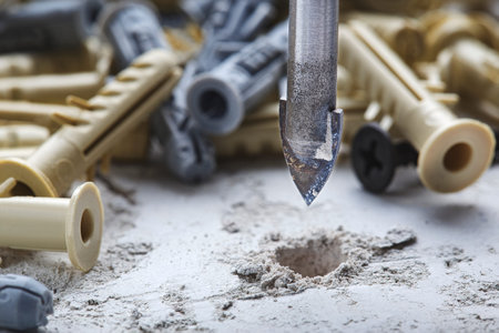 Ceramic drill bit make holes in concrete wall with industrial drill. building work industry.