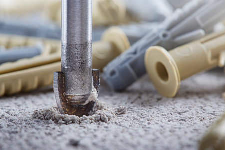 Ceramic drill bit make holes in concrete wall with industrial drill. building work industry.の写真素材